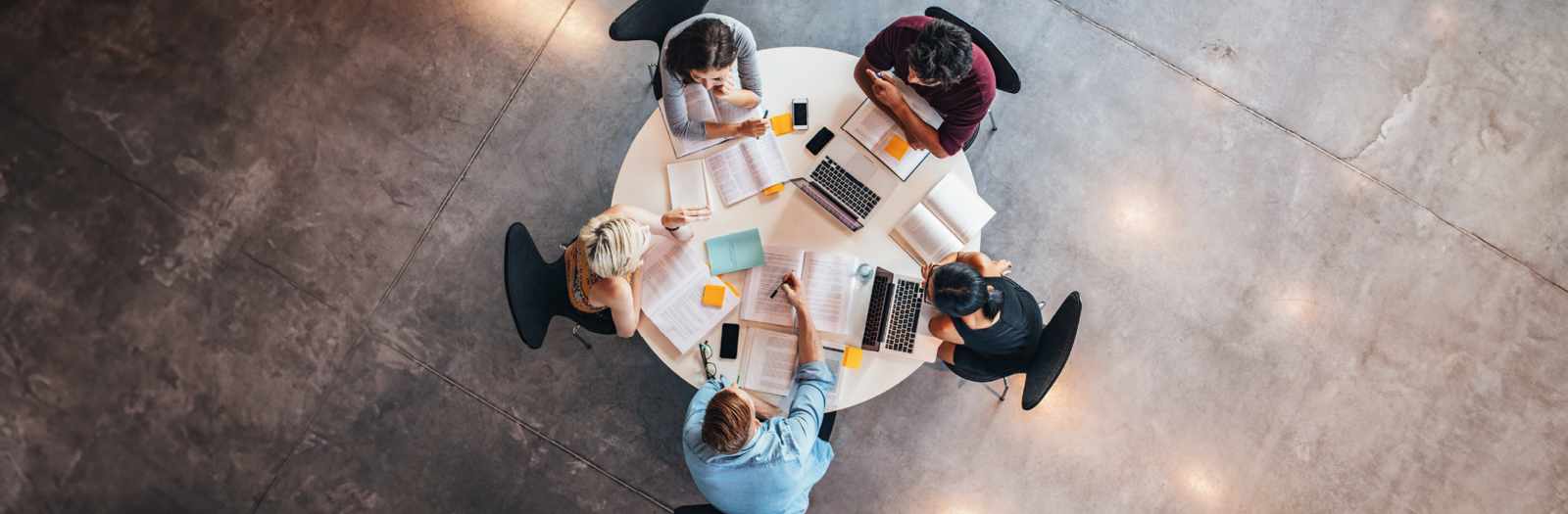 Young reserchers studying around a table